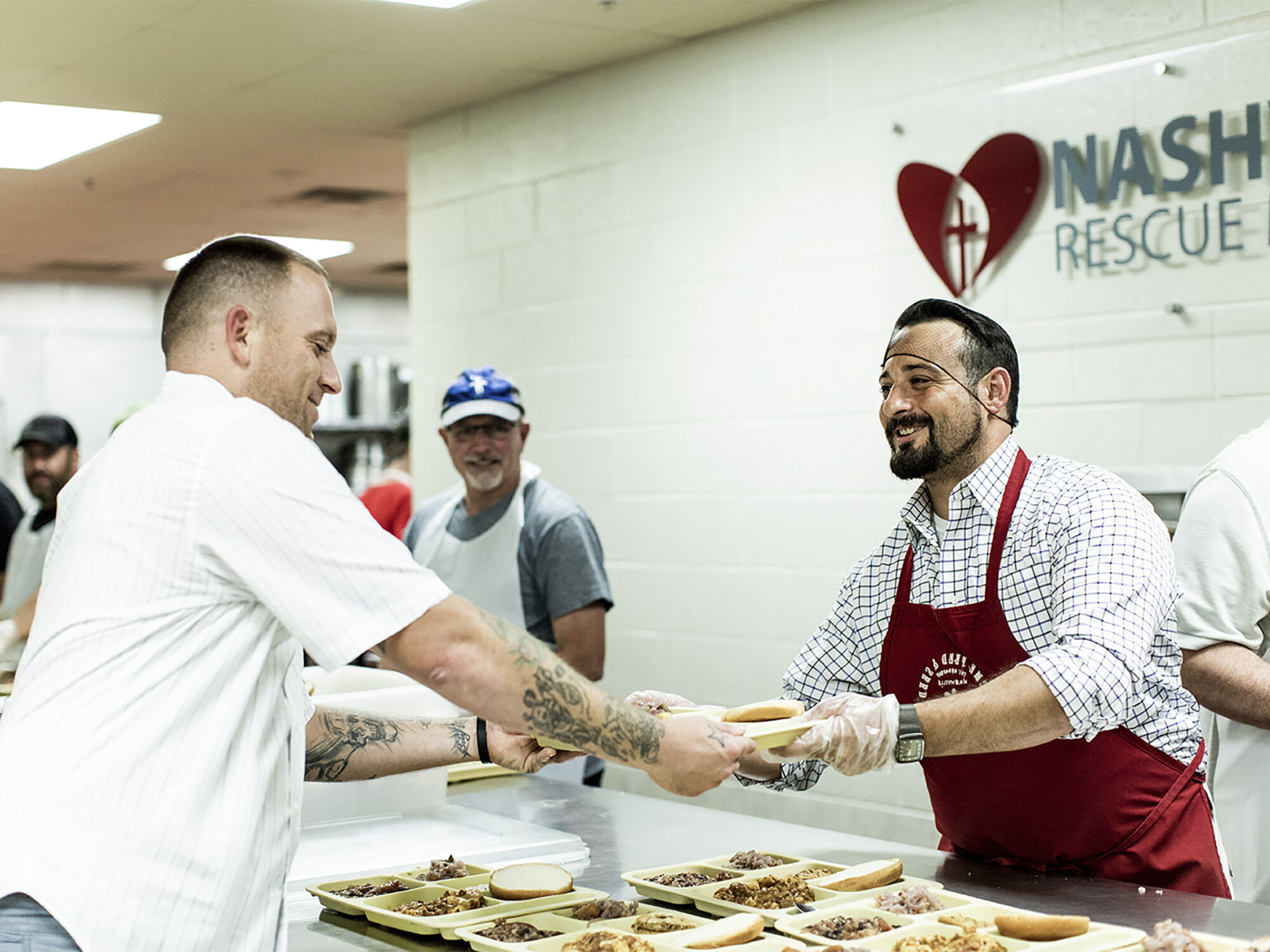 A Nashville Rescue Mission volunteer aiding those in need in the Nashville community.